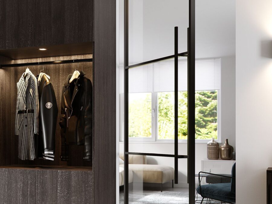 Woonkamer met zwarte stalen taatsdeur voor een extra ruimtelijk gevoel in huis.