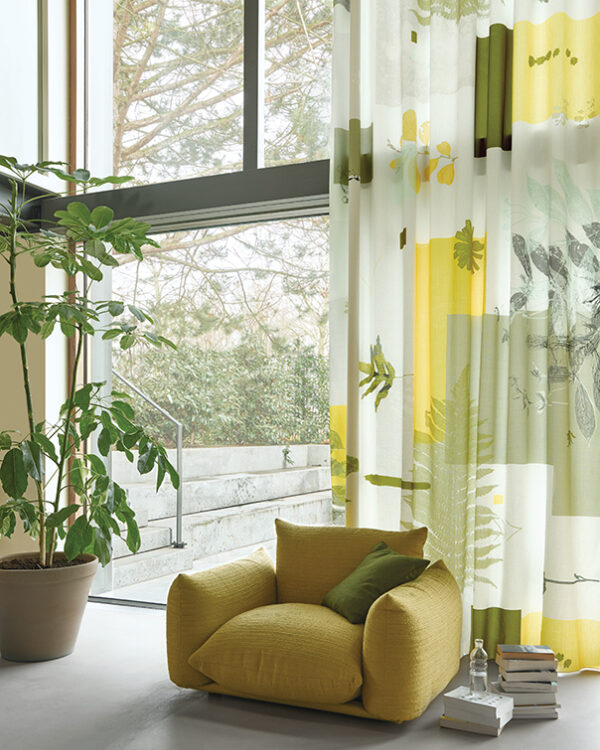 Groen/gele vitrages met dessin in de zithoek